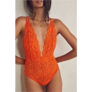 We are hah coming in haht lace bodysuit small orange